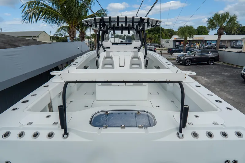  Yacht Photos Pics 2024 Freeman 38 boat with spacious deck and seating, parked outdoors.