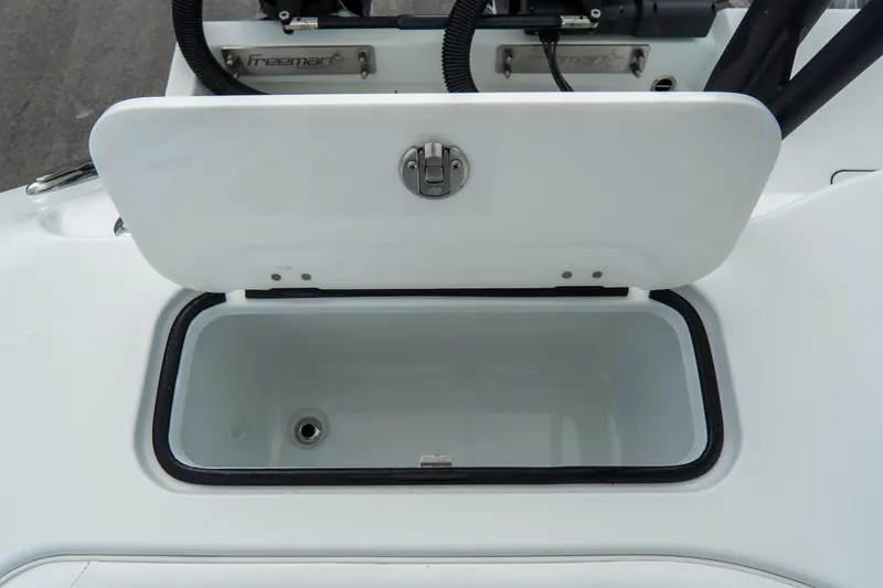  Yacht Photos Pics Open storage compartment on 2024 Freeman 38 boat, showcasing interior space and latch mechanism.