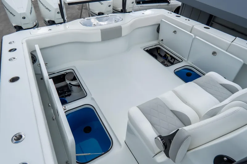  Yacht Photos Pics 2024 Freeman 38 boat interior with storage compartments and cushioned seating.