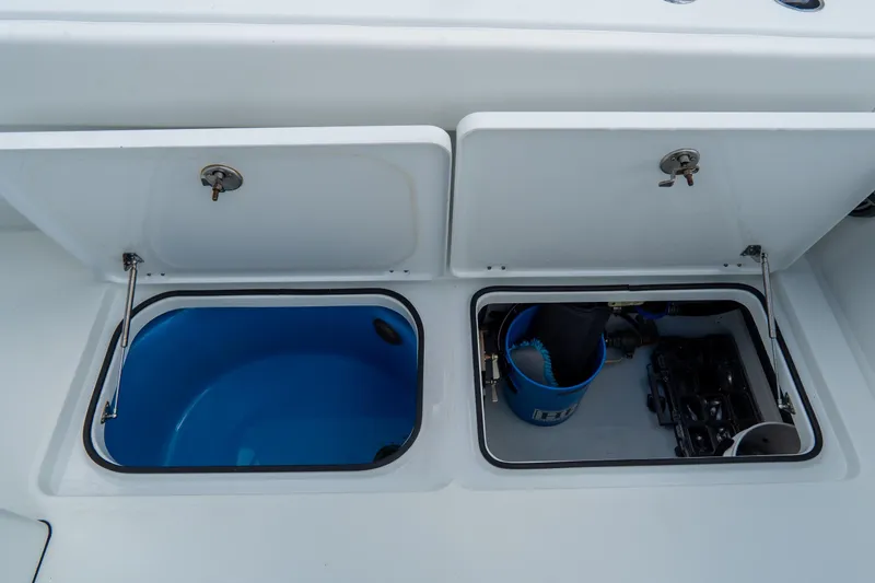  Yacht Photos Pics Open storage compartments on a 2024 Freeman 38 boat, featuring a blue interior and equipment.