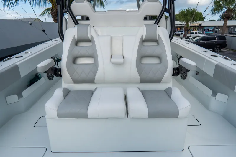  Yacht Photos Pics 2024 Freeman 38 boat interior with dual cushioned seats and modern design.