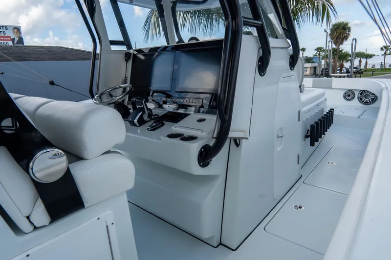  Yacht Photos Pics 2024 Freeman 38 boat interior with modern helm and seating, showcasing sleek design.