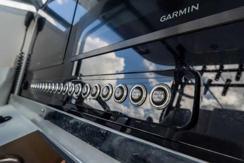  Yacht Photos Pics Control panel of 2024 Freeman 38 boat with Garmin display and water pump buttons.