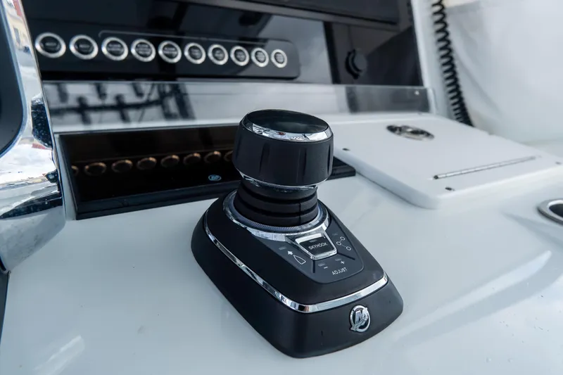  Yacht Photos Pics Control panel of 2024 Freeman 38 boat with joystick and buttons.