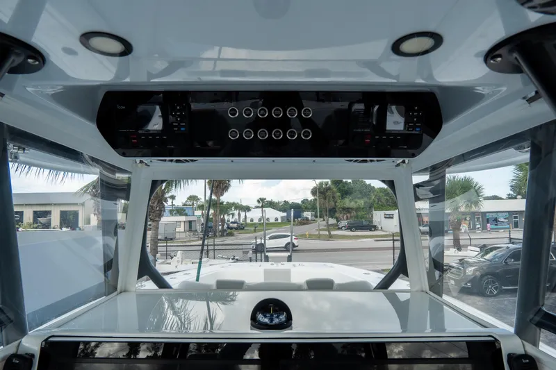  Yacht Photos Pics 2024 Freeman 38 boat interior with control panel and exterior view.