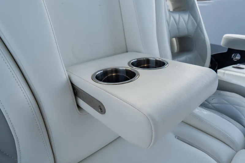  Yacht Photos Pics Luxurious white leather seating with cup holders in 2024 Freeman 38 model.
