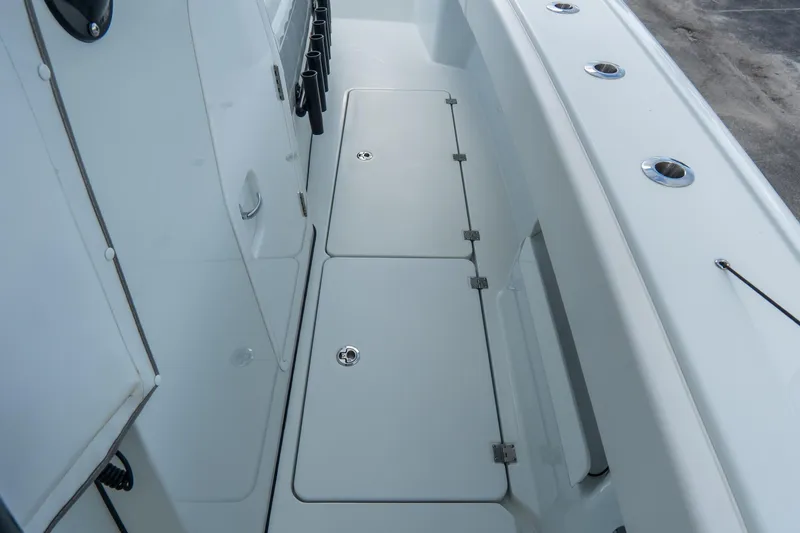  Yacht Photos Pics 2024 Freeman 38 boat deck with storage compartments and rod holders.