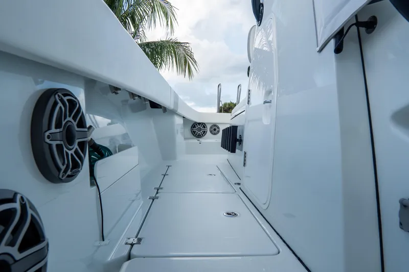  Yacht Photos Pics 2024 Freeman 38 boat interior with speakers and sleek design under palm trees.