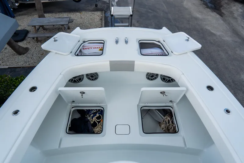  Yacht Photos Pics 2024 Freeman 38 boat deck with open storage compartments and safety gear.