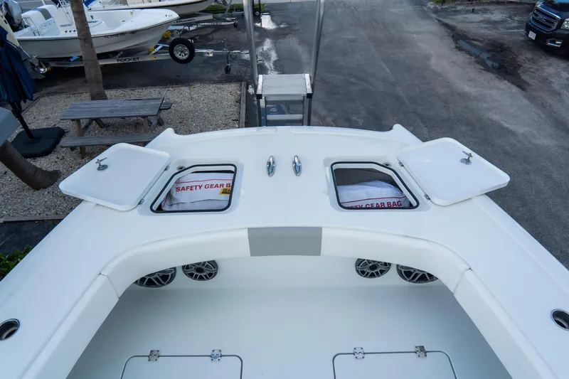  Yacht Photos Pics 2024 Freeman 38 boat deck with open storage compartments and safety gear bags.