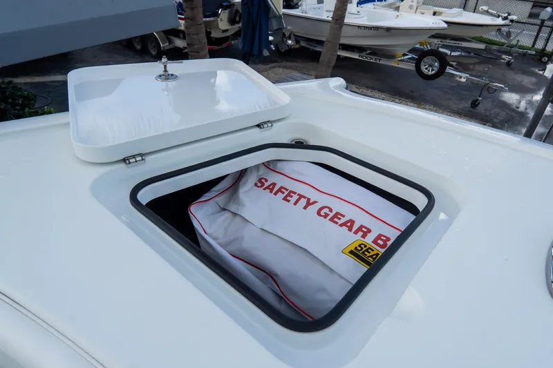  Yacht Photos Pics Open hatch on 2024 Freeman 38 boat revealing safety gear bag.