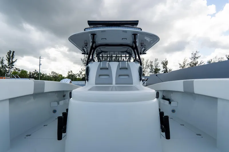  Yacht Photos Pics 2024 Freeman 38 boat with sleek design, spacious deck, and modern features under cloudy sky.