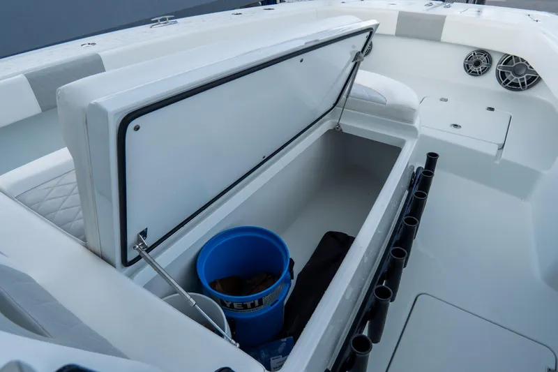  Yacht Photos Pics Open storage compartment on 2024 Freeman 38 boat with blue bucket inside.