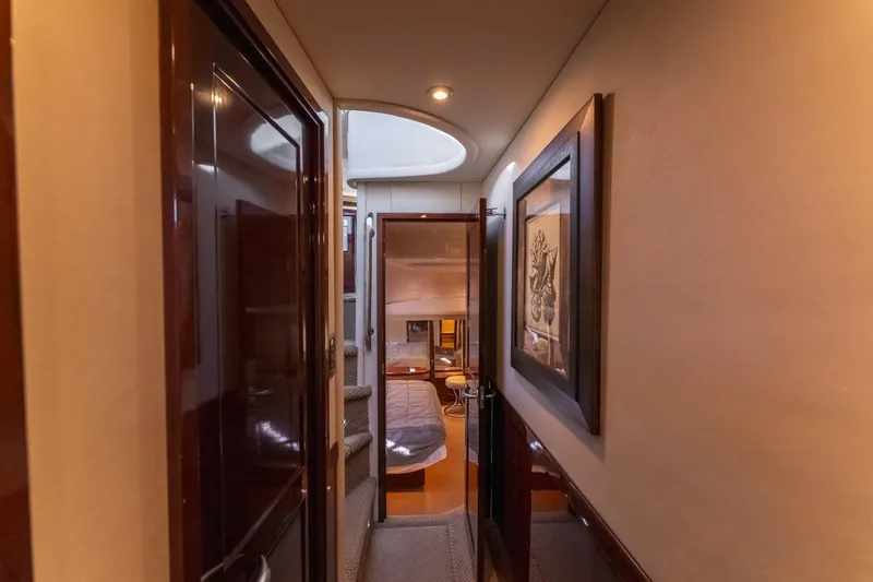  Yacht Photos Pics Interior hallway of 2008 Sea Ray 58 Sedan Bridge yacht, featuring elegant wood finishes.