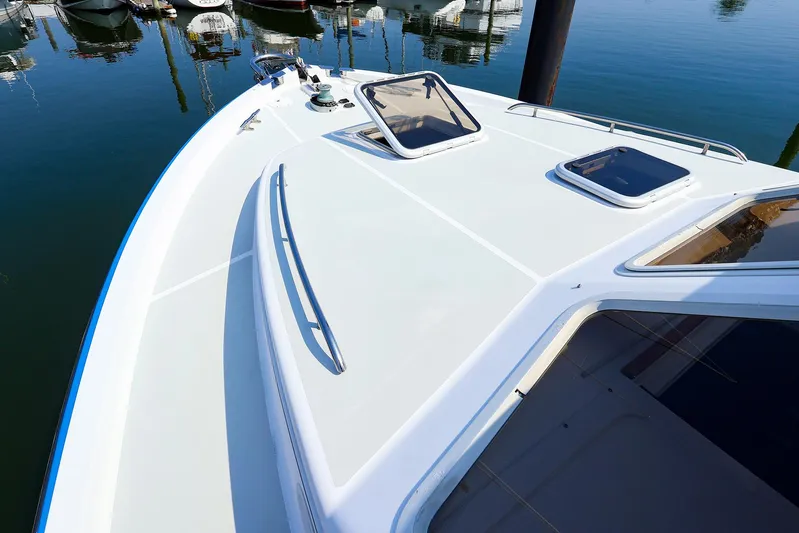  Yacht Photos Pics Bow view of 2004 True North 38 boat docked in calm waters.