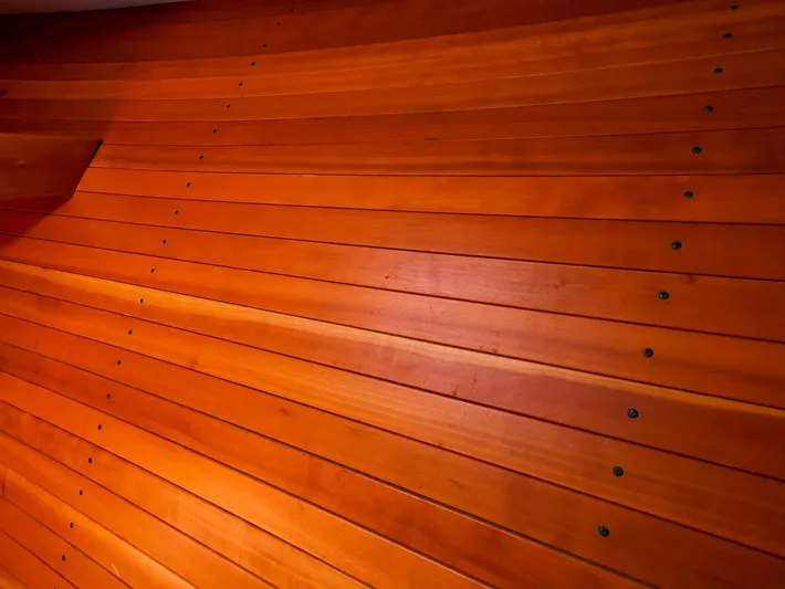  Yacht Photos Pics Polished wooden interior of a 2004 True North 38 boat, showcasing craftsmanship.