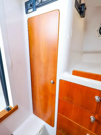  Yacht Photos Pics Wooden cabinet and drawers inside a 2004 True North 38 boat interior.
