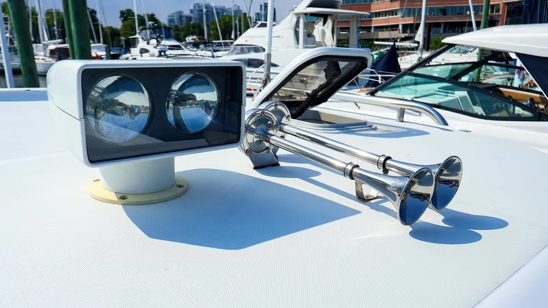  Yacht Photos Pics Rooftop of 2004 True North 38 boat with spotlight and dual trumpet horns.