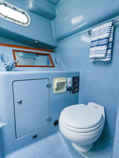  Yacht Photos Pics Compact marine bathroom in 2004 True North 38 yacht, featuring toilet and sink.