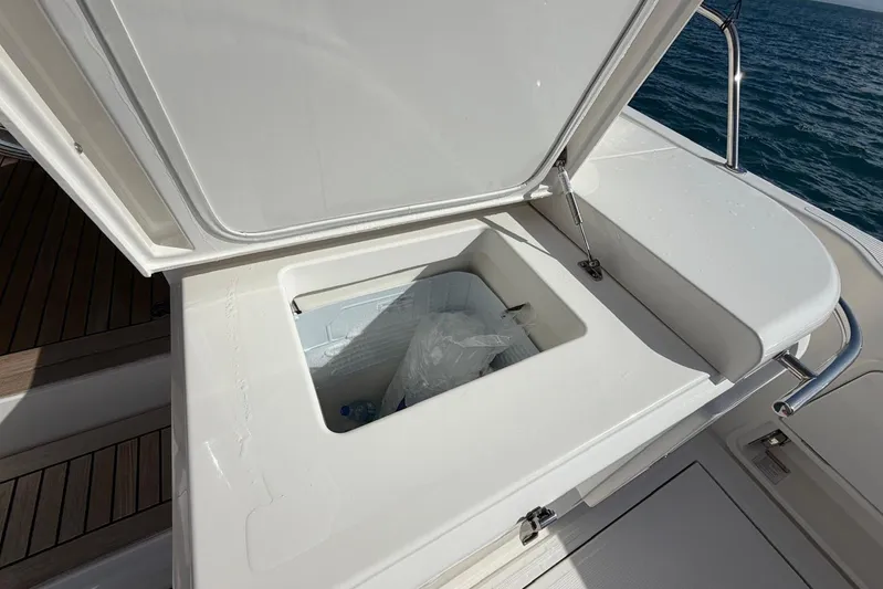  Yacht Photos Pics Open storage compartment on 2021 Riviera 50 Sports Motor Yacht, with ocean view.