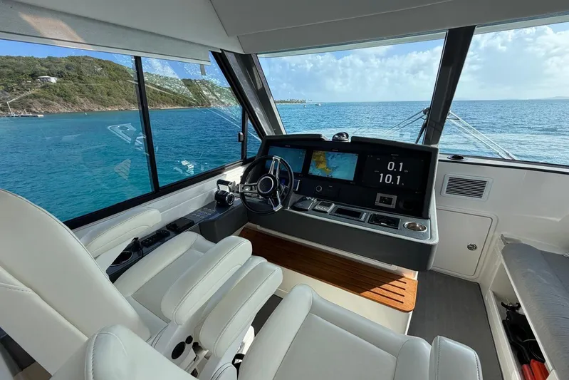  Yacht Photos Pics 2021 Riviera 50 Sports Motor Yacht helm with ocean view and modern navigation system.