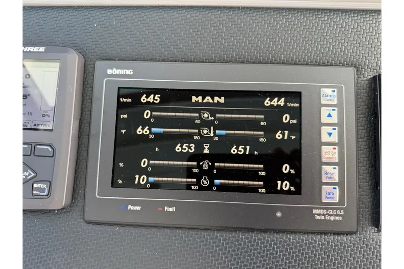  Yacht Photos Pics Instrument panel of a 2021 Riviera 50 Sports Motor Yacht displaying engine metrics.