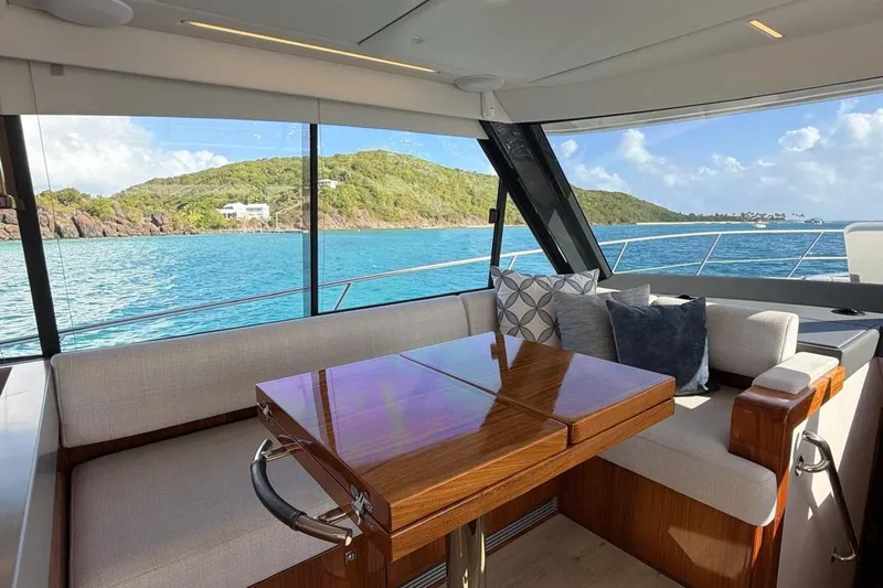  Yacht Photos Pics Luxurious interior of 2021 Riviera 50 Sports Motor Yacht with scenic ocean view.