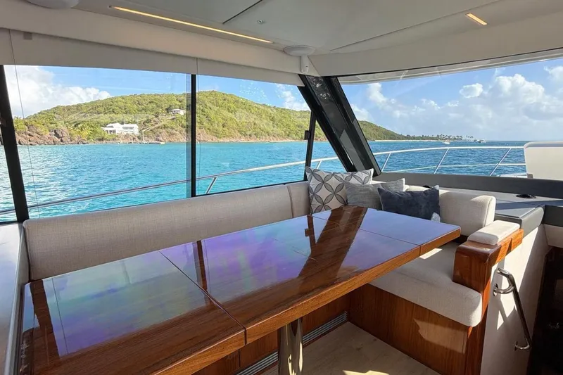  Yacht Photos Pics Interior of 2021 Riviera 50 Sports Motor Yacht with ocean view and elegant seating.