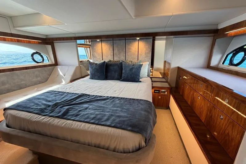  Yacht Photos Pics Luxurious bedroom interior of 2021 Riviera 50 Sports Motor Yacht with ocean view.