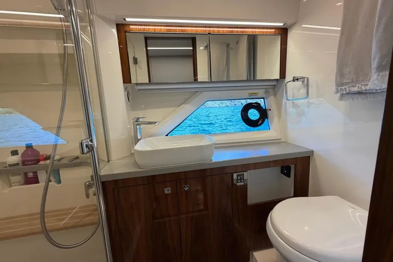  Yacht Photos Pics Luxurious bathroom in 2021 Riviera 50 Sports Motor Yacht with ocean view.