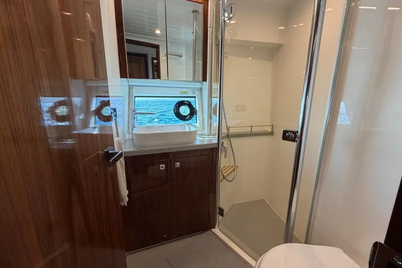  Yacht Photos Pics Luxurious bathroom in 2021 Riviera 50 Sports Motor Yacht with ocean view.
