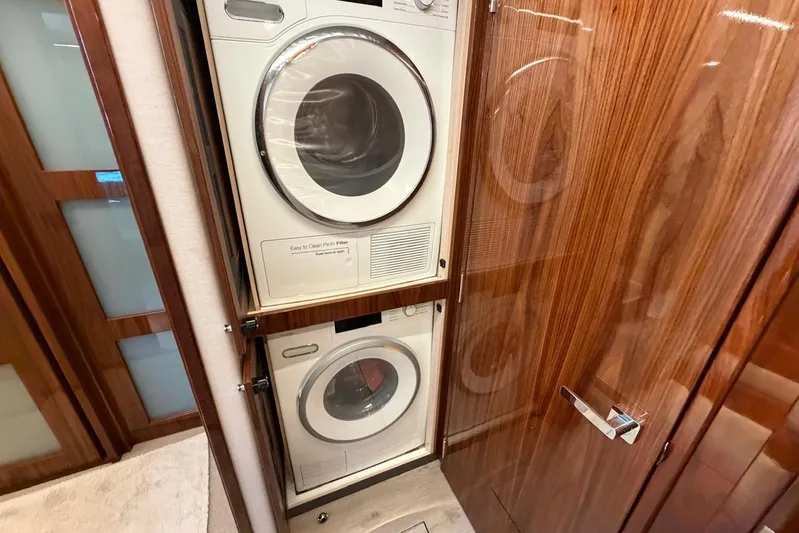  Yacht Photos Pics Laundry appliances in 2021 Riviera 50 Sports Motor Yacht's wooden interior.