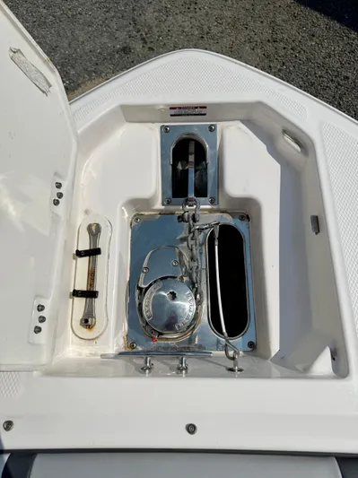  Yacht Photos Pics 2023 Chaparral 280 OSX boat anchor compartment with open hatch and stainless steel fittings.