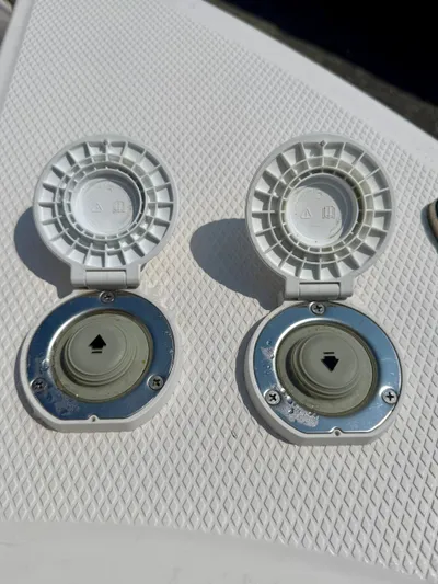  Yacht Photos Pics 2023 Chaparral 280 OSX boat deck fittings, open covers, textured surface.