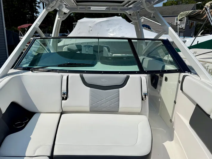  Yacht Photos Pics 2023 Chaparral 280 OSX boat interior with white seating and windshield.