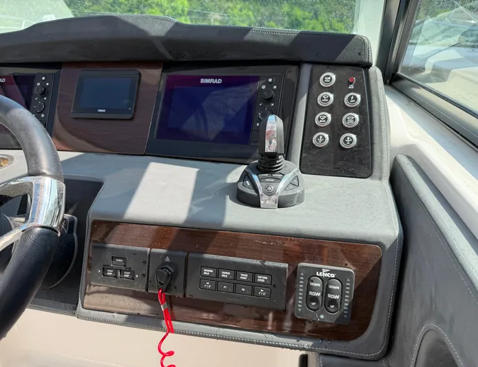  Yacht Photos Pics Control panel of 2023 Chaparral 280 OSX boat with navigation screens and joystick.