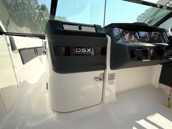  Yacht Photos Pics 2023 Chaparral 280 OSX boat interior with modern dashboard and controls.