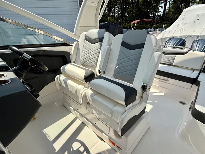  Yacht Photos Pics 2023 Chaparral 280 OSX boat interior with luxurious dual captain seats.