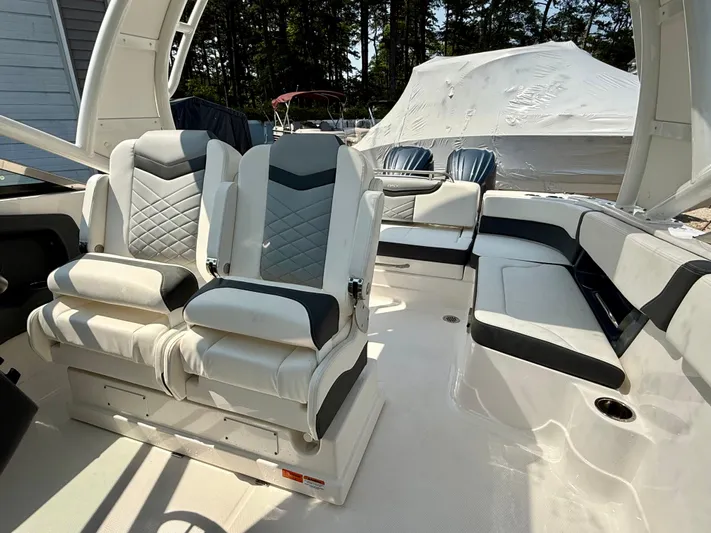 Yacht Photos Pics 2023 Chaparral 280 OSX boat interior with luxurious seating and modern design.
