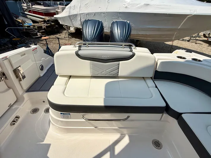  Yacht Photos Pics 2023 Chaparral 280 OSX boat interior with cushioned seating and dual engines.