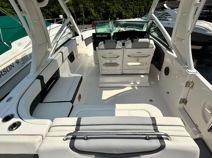  Yacht Photos Pics 2023 Chaparral 280 OSX boat interior with white seating and modern design.