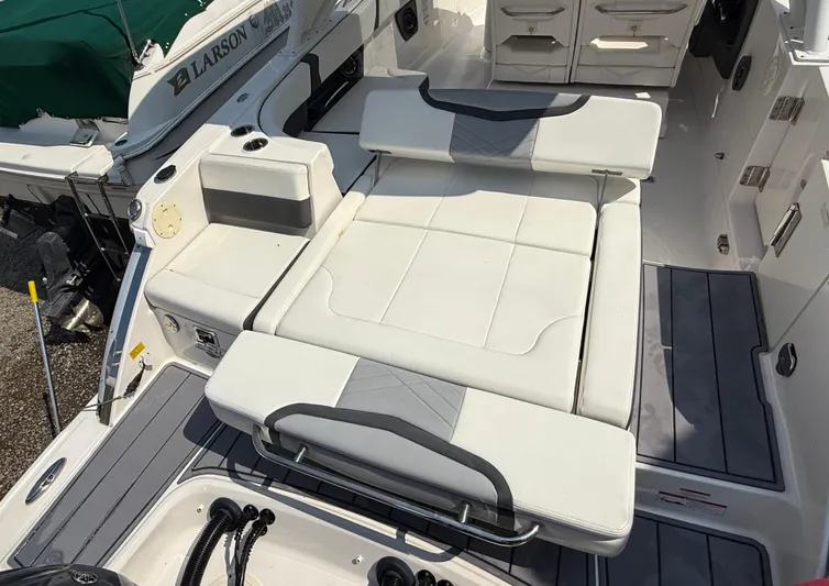  Yacht Photos Pics 2023 Chaparral 280 OSX boat interior with white cushioned seating and sleek design.