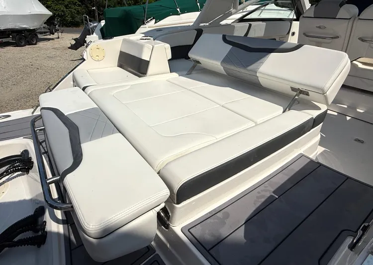  Yacht Photos Pics 2023 Chaparral 280 OSX boat with luxurious white seating and sleek design.