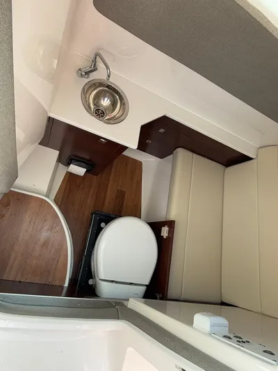  Yacht Photos Pics 2023 Chaparral 280 OSX boat interior with sink and toilet.