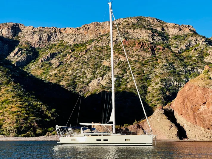 Freedom Yacht Photos Pics Beneteau Oceanis 55 yacht sailing near rocky coastline, 2015 model.