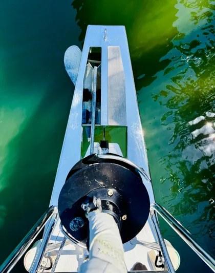 Freedom Yacht Photos Pics Bow of 2015 Beneteau Oceanis 55 sailboat with clear water reflection.