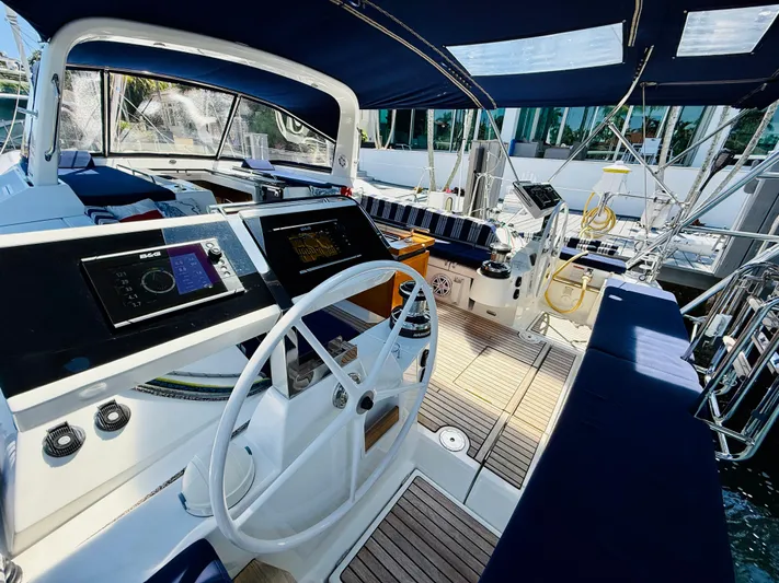 Freedom Yacht Photos Pics 2015 Beneteau Oceanis 55 yacht cockpit with dual steering wheels and navigation equipment.