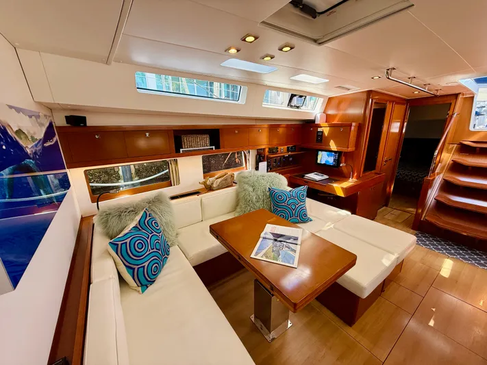 Freedom Yacht Photos Pics Luxurious interior of 2015 Beneteau Oceanis 55 yacht with elegant seating and modern design.