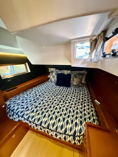 Freedom Yacht Photos Pics Cozy cabin interior of 2015 Beneteau Oceanis 55 yacht with patterned bedding.