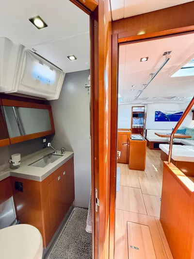 Freedom Yacht Photos Pics Interior of 2015 Beneteau Oceanis 55 yacht, featuring modern bathroom and spacious living area.